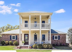 Cream plantation-style Texas home with premium window installation by Andrus Window Co.