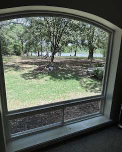 Custom arched window with Texas lake view