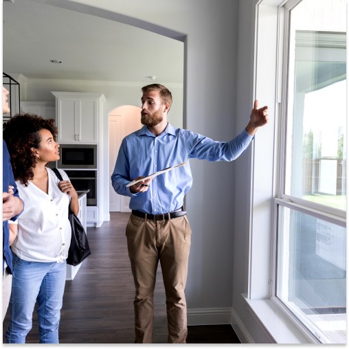 Andrus Window Co. walking homeowners through window options during an in-home consultation