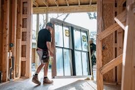 Andrus Window Co. crew setting new windows into a framed new-construction home in North Texas